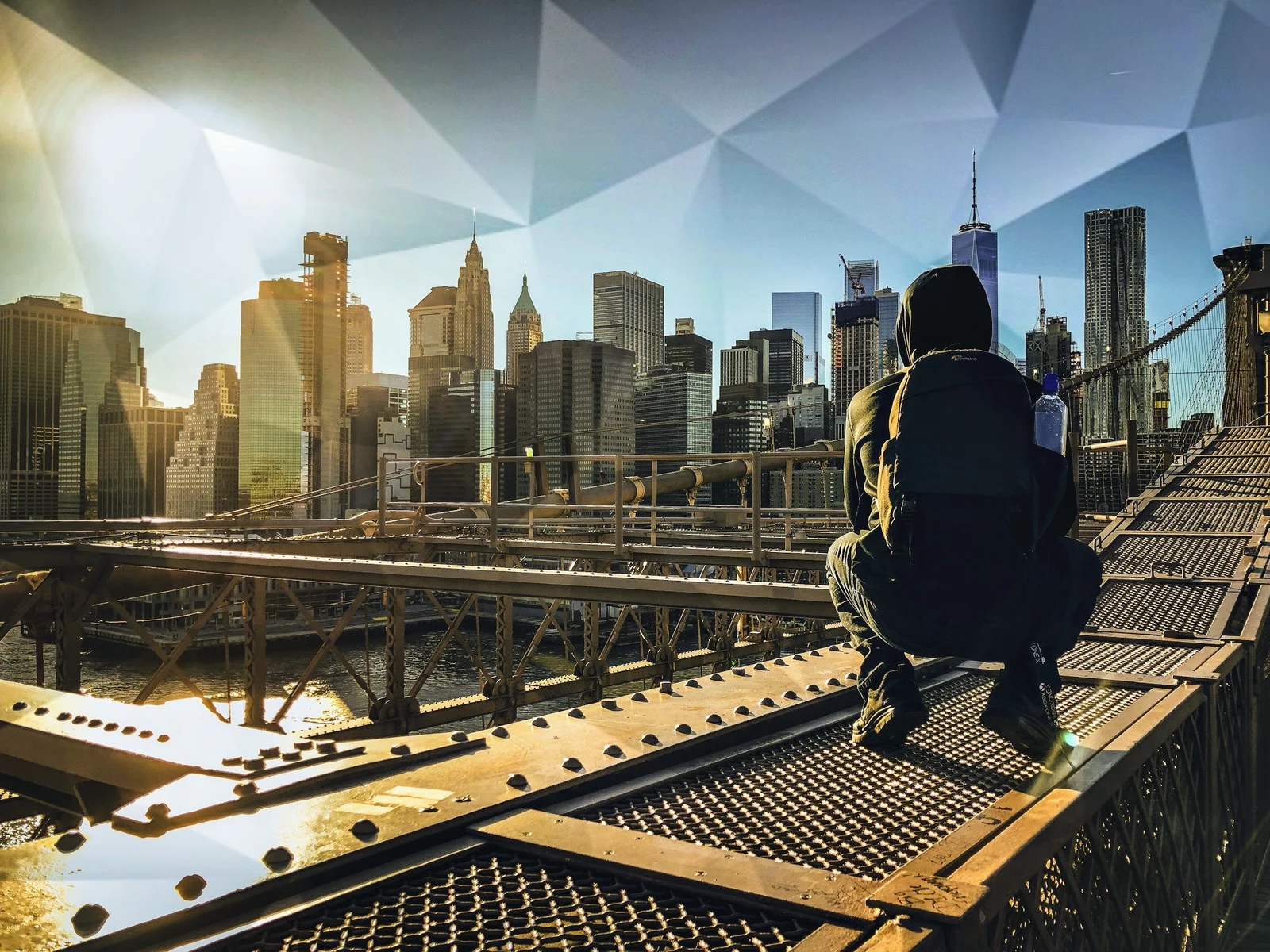 A figure crouched on the Brooklyn Bridge under a prism-cut sky over lower Manhattan