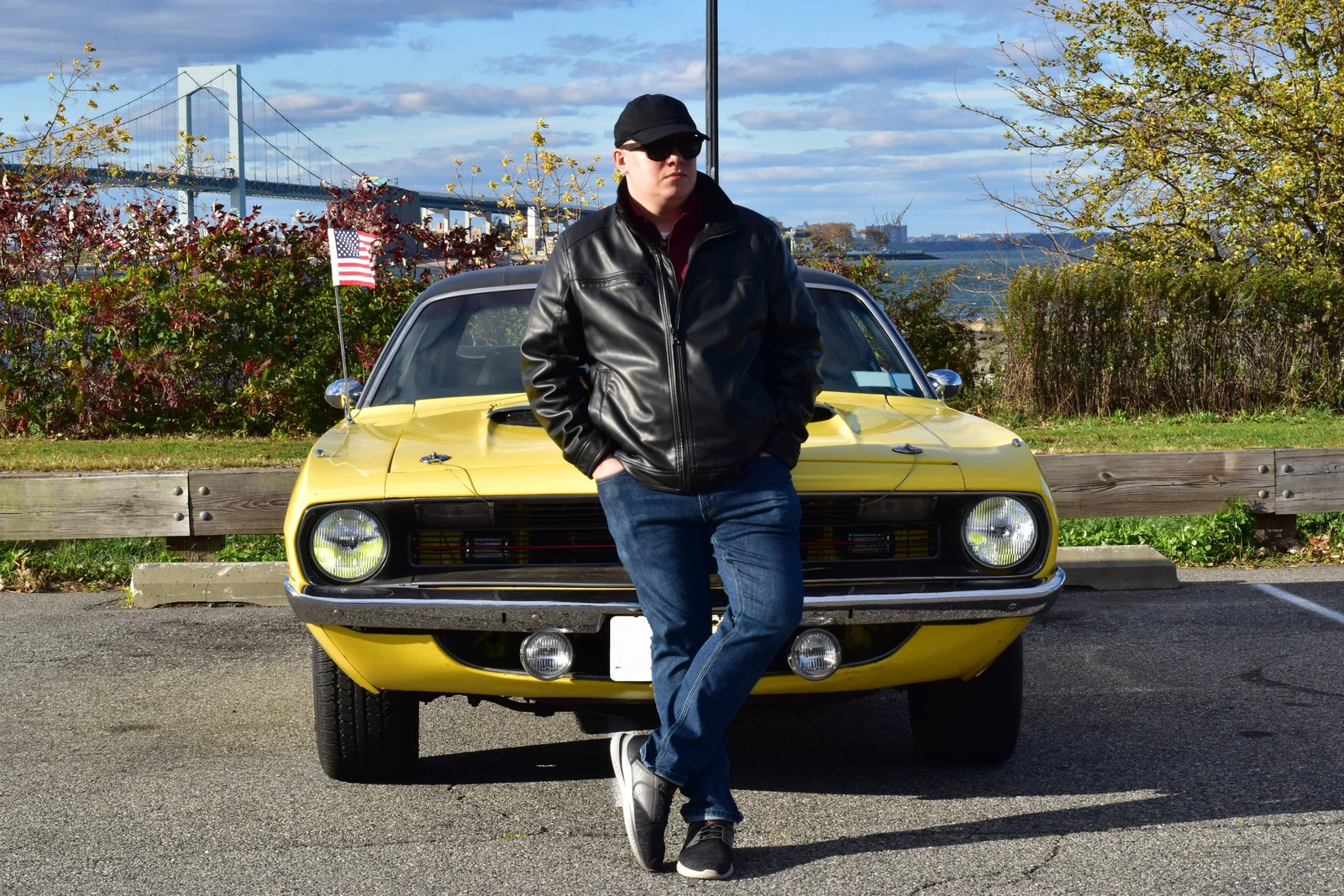 The owner of the yellow 'Cuda in a leather jacket at the waterfront