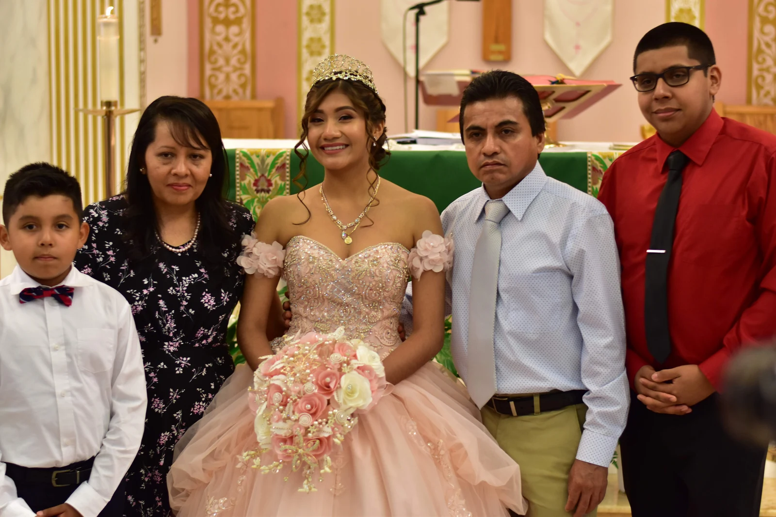 Quinceañera family portrait at the church