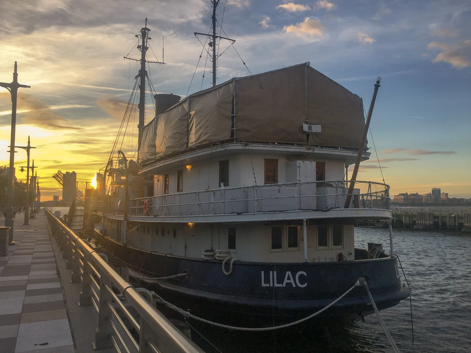The historic ship Lilac moored on the Hudson River waterfront at sunset